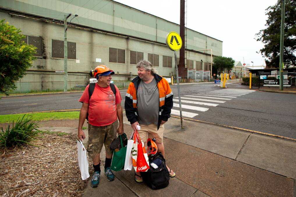 Paul Johnson and David Archer leave the Molycop bar mill at Waratah for the last time this week. Picture by Jonathan Carroll