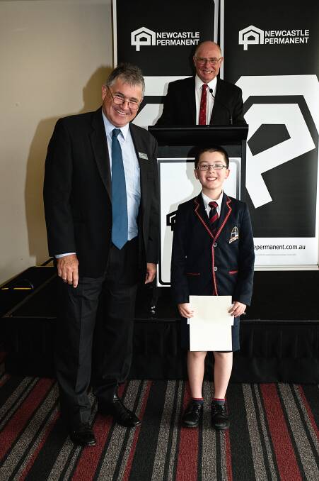 HIGH ACHIEVER: Theodore Brown with Bryan Campbell, left, the director of public schools in NSW, and Merv Curran, co-ordinator of the Newcastle Permanent maths competition. Picture: Supplied