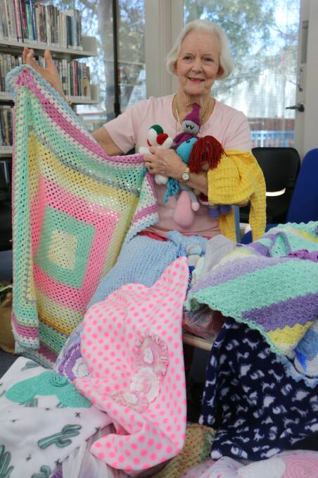 BABY BUNDLES: Jenny Dacomb with a sample of the knitted items donated on Wednesday. Picture: David Stewart