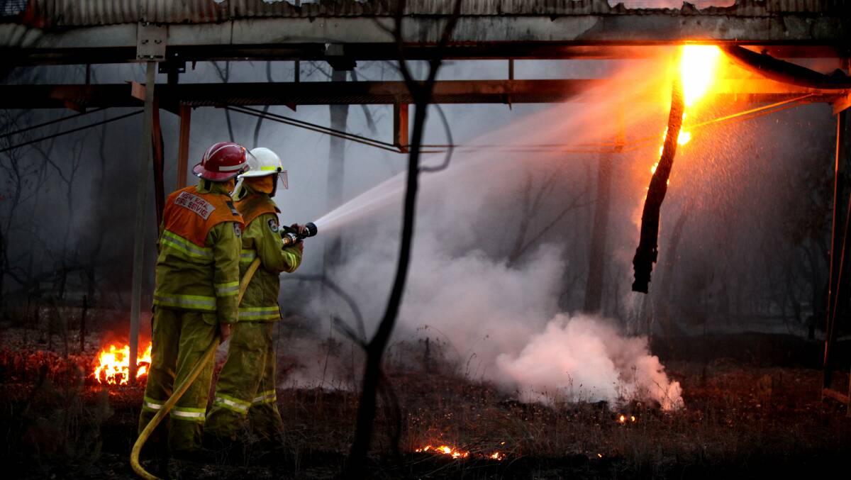 FUNDING SWITCH: NSW Fire and Rescue personnel extinguish a fire at the old Munmorah Power Station. The state will fund introduce a new funding method for emergency services from July. Picture: Phil Hearne
