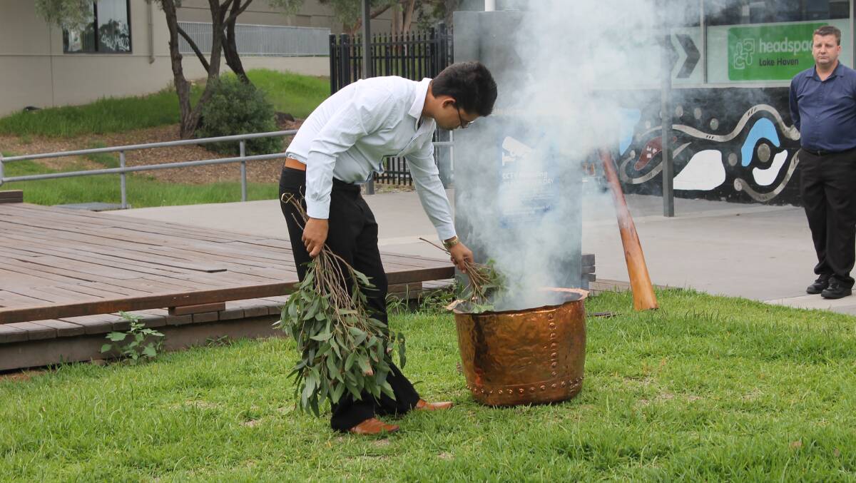 INDIGENOUS PASSION: Kyle Freeman begins the traditional smoking ceremony before the welcome to country address at Tuesday's launch of the Deadly Yakka program at Lake Haven. Picture: Supplied