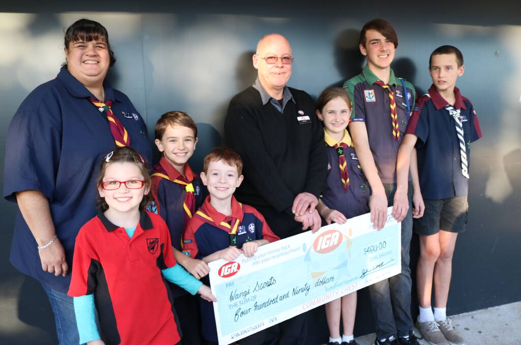 DONATION: Joeys Scout leader Sharon Smith with Wangi Wangi IGA supermarket manager John O'Brien and a delegation of Wangi Wangi Scouts at the cheque presentation. Picture: Supplied