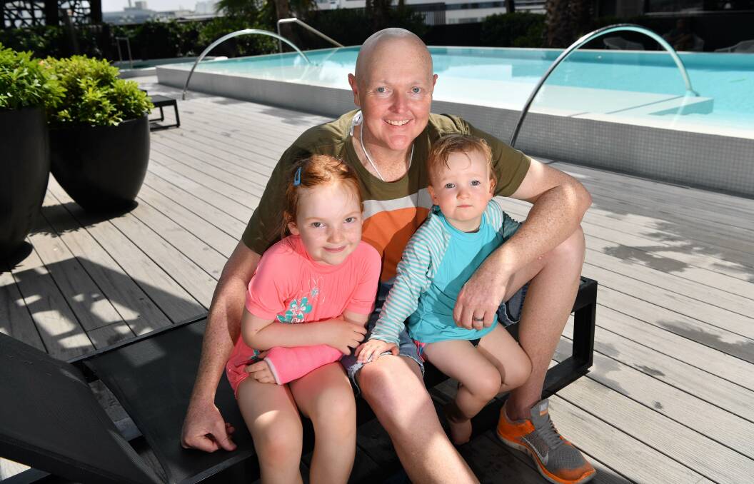 FAMILY MAN: The late Jarrod Lyle, pictured with daughters Lusi, left, and Jemma, in January this year. The golfer passed away on August 8. The Morisset Golf Pro-Am next month will raise money for Lyle's family. Picture: Joe Armao