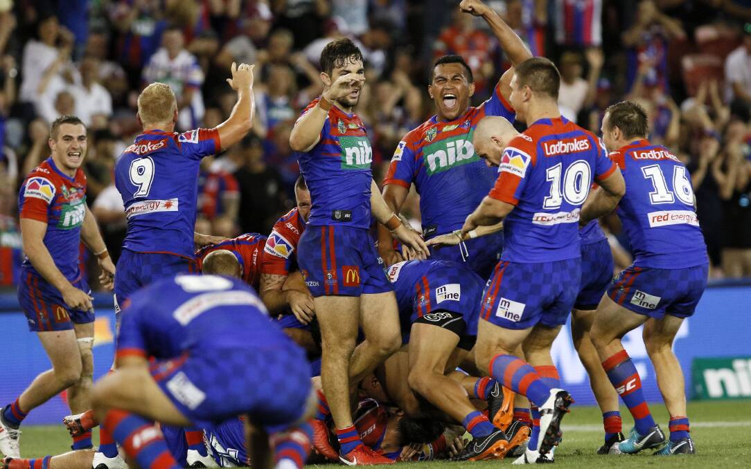 Hero: Mitchell Pearce is swamped, teammates celebrate and 23,516 fans go wild after the Knights halfback nails the winning field goal in golden point to sink Manly at McDonald Jones Stadium. Picture: Darren Pateman