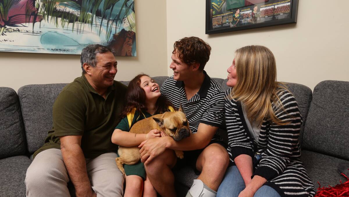 Tight-knit: The Ponga family - Andre, Kayley, Kalyn and Adine with Milo at the family home in Charlestown. Picture: Jonathan Carroll.
