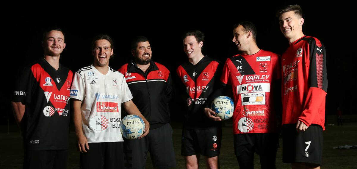 Edgeworth coach Damian Zane with several Eagles players 