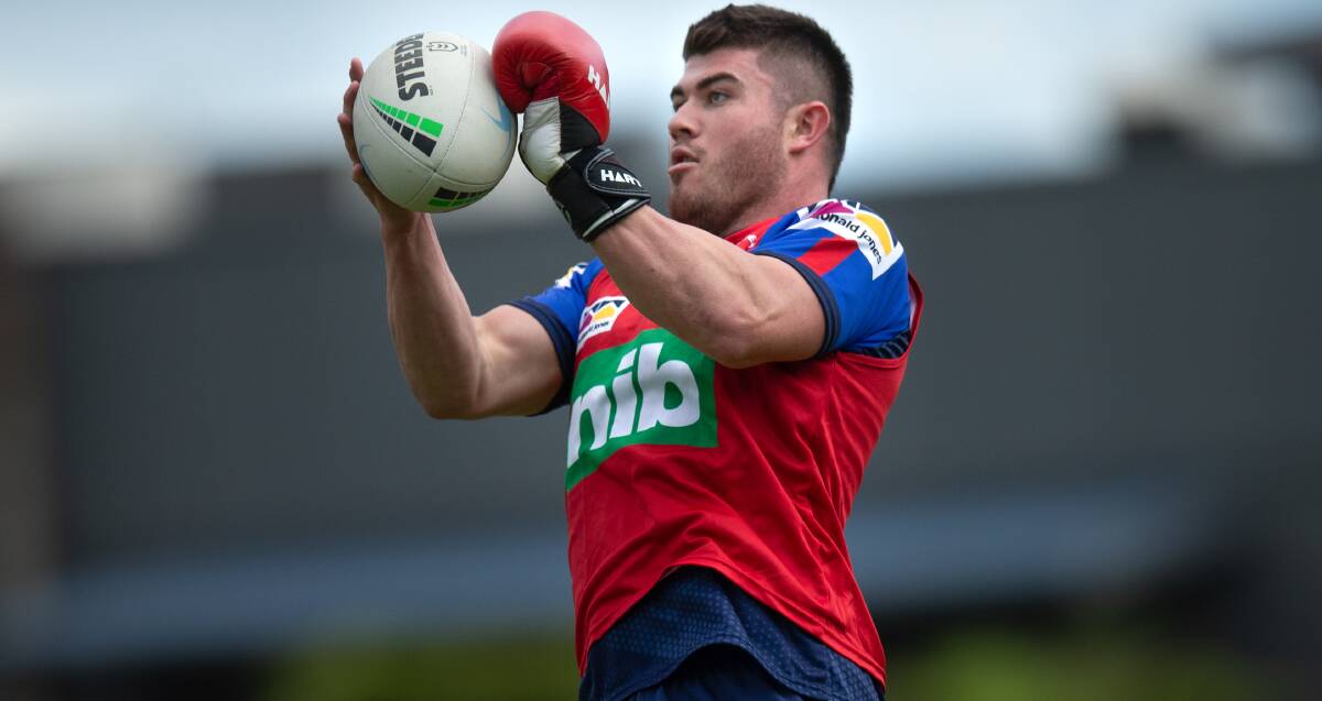 Flying high: Knights centre Bradman Best sporting a boxing glove at training following off-season thumb surgery. Best will stay on the left edge next season despite the signing of Dane Gagai. Picture: Marina Neil. 