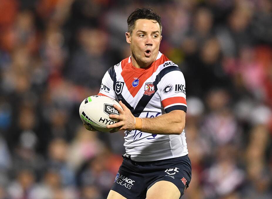Dangerman: Cooper Cronk will spearhead a desperate and hungry Sydney Roosters side against the Knights on Saturday.