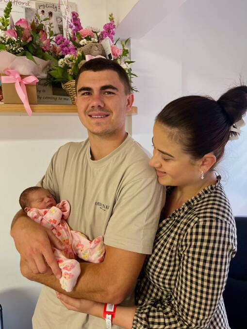 Proud dad Jake Clifford with baby Naivy and wife Stephanie
