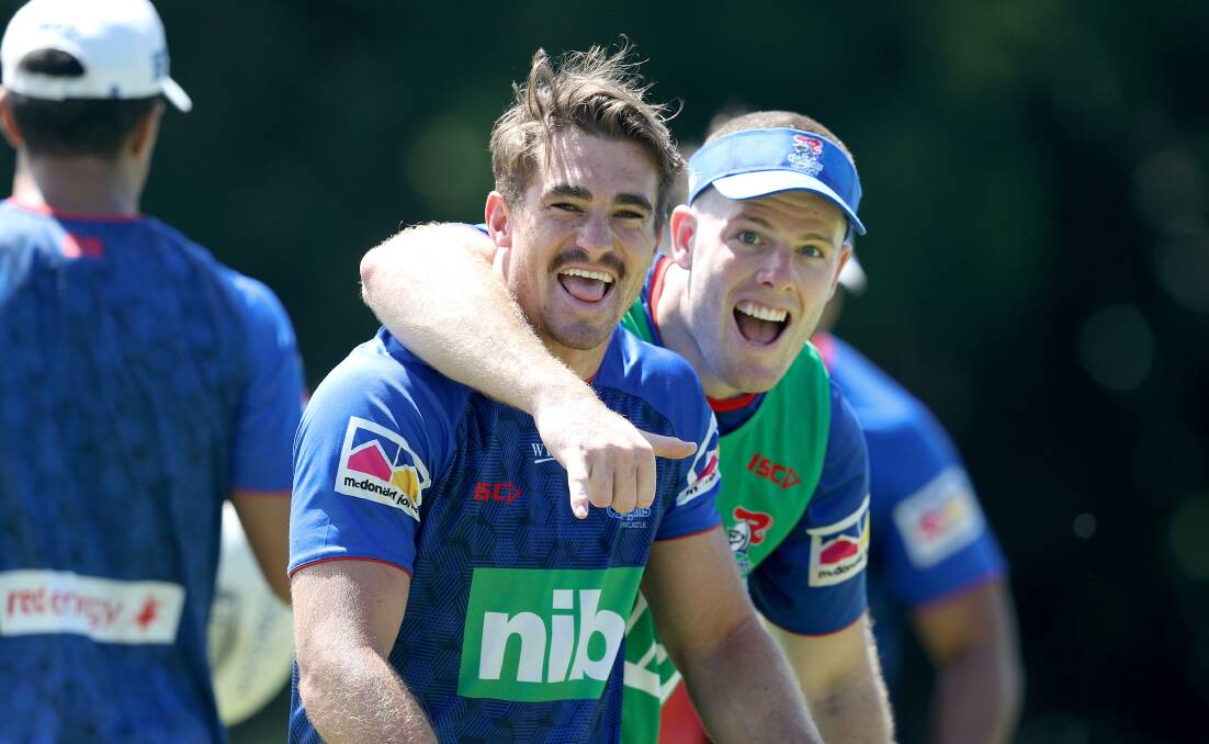 Plenty to smile about: Connor Watson and Knights teammate Lachlan Fitzgibbon share a laugh during pre-season training. Watson has embraced his move to fullback in a positional switch with Kalyn Ponga.