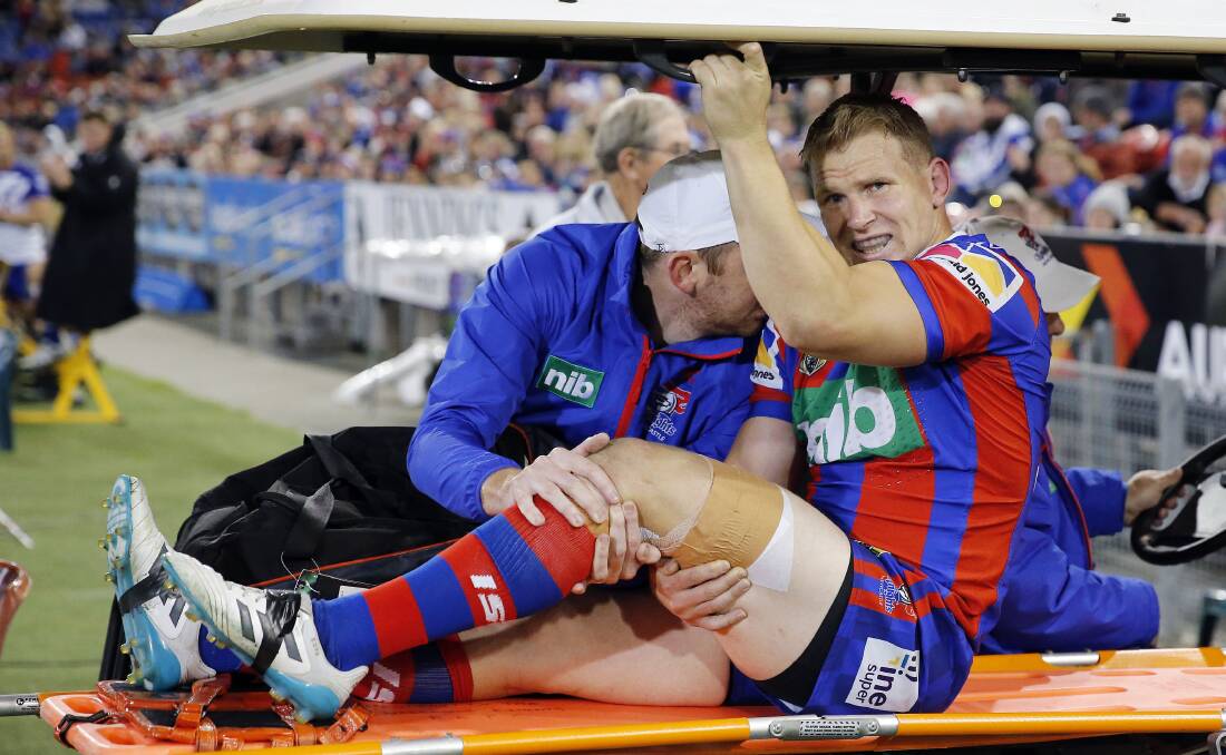 Agony: Slade Griffin in plenty of pain after rupturing his ACL for a fourth time.