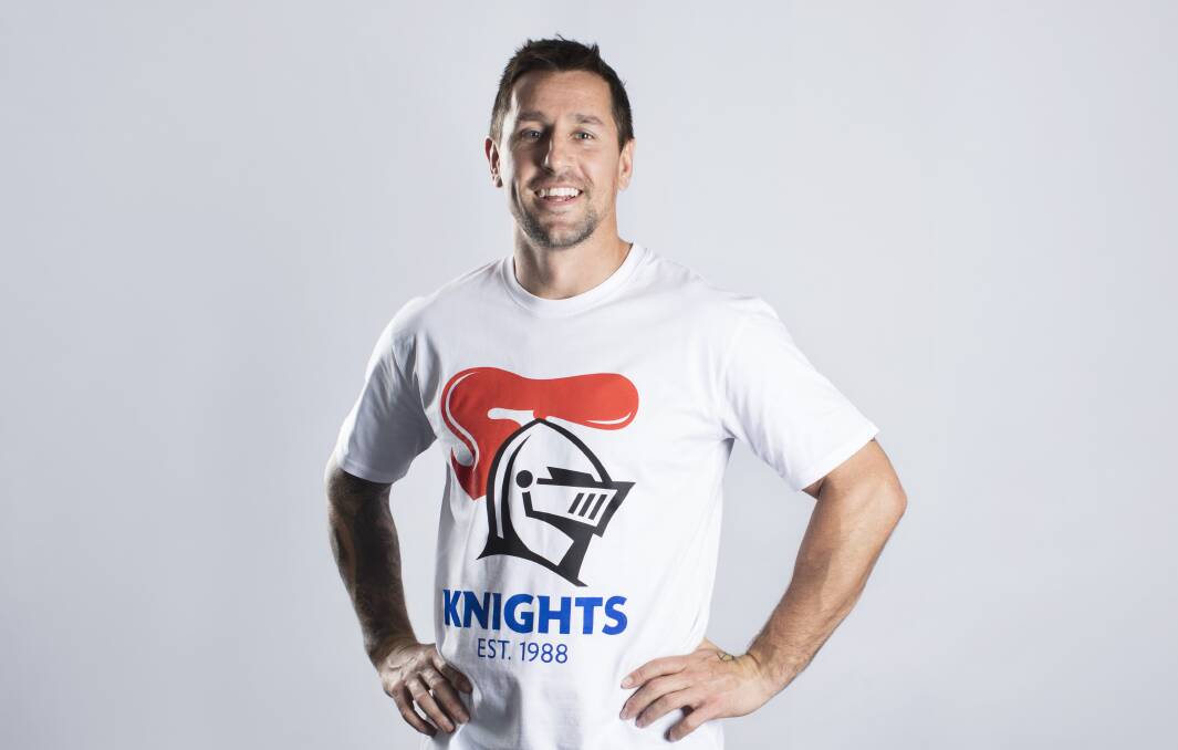 Trendy: Knights skipper Mitchell Pearce models the new club logo.
