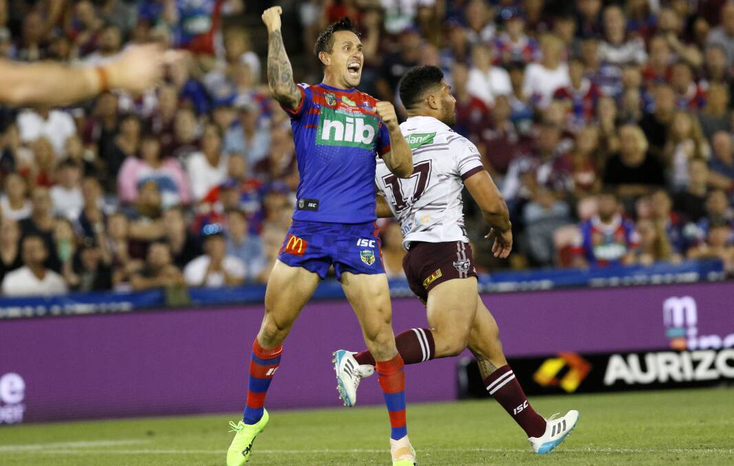 Nailed it: Mitchell Pearce punches the sky after sealing a one point win over Manly with a field goal for the Knights in round one last season.
