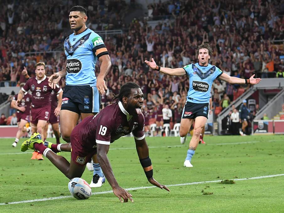 How sweet it is: Knights winger and Maroons debutant Edrick Lee celebrates after scoring a first half try for Queensland in the Origin decider at Suncorp Stadium. Picture: AAP