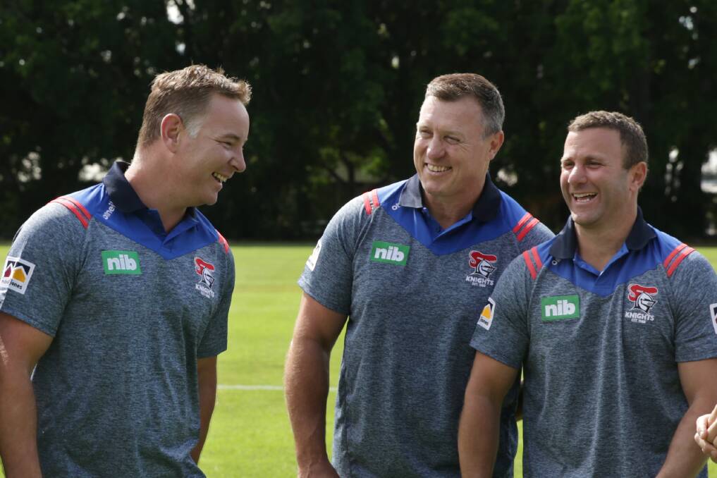 Brains trust: Knights coach Adam O'Brien shares a laugh with his assistants David Furner and Willie Peters. Picture: Simone De Peak.