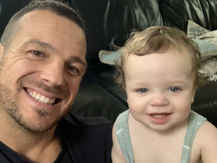 Proud dad: A happy and healthy Jarrod Mullen with his daughter Stevie. The former Newcastle Knights star is now living on the Sunshine Coast and says having a baby girl is the best thing he has ever done. 
