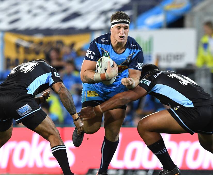 On the charge: Gold Coast Titans prop Jarrod Wallace has been in Newcastle for talks with Knights officials over his playing future and is one of two Queensland Origin props in Newcastle's sights for 2019. Picture: AAP