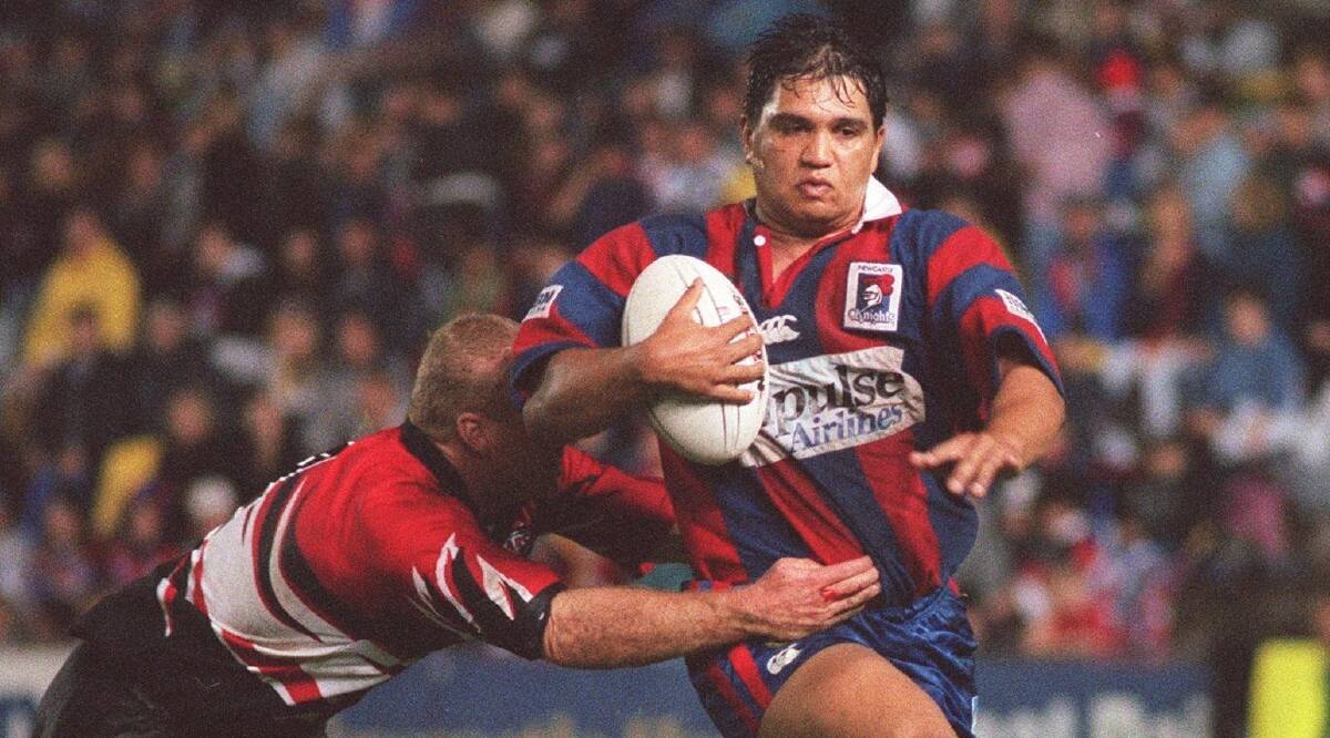 Handful: Newcastle Knights centre Owen Craigie tries to get on the outside of North Sydney's Michael Buettner in a club game in 1998. Picture: Stefan Moore.