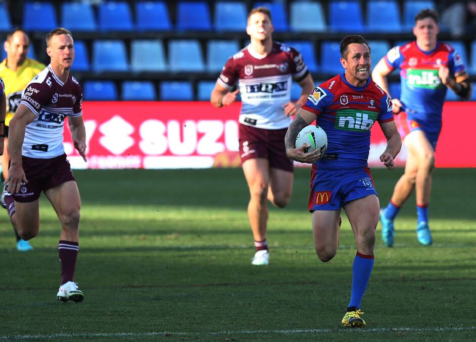 Whole-hearted: Skipper Mitchell Pearce surges up-field in a 30 metre burst after taking an intercept late in his side's 26-24 win over Manly. Picture: Simone De Peak. 