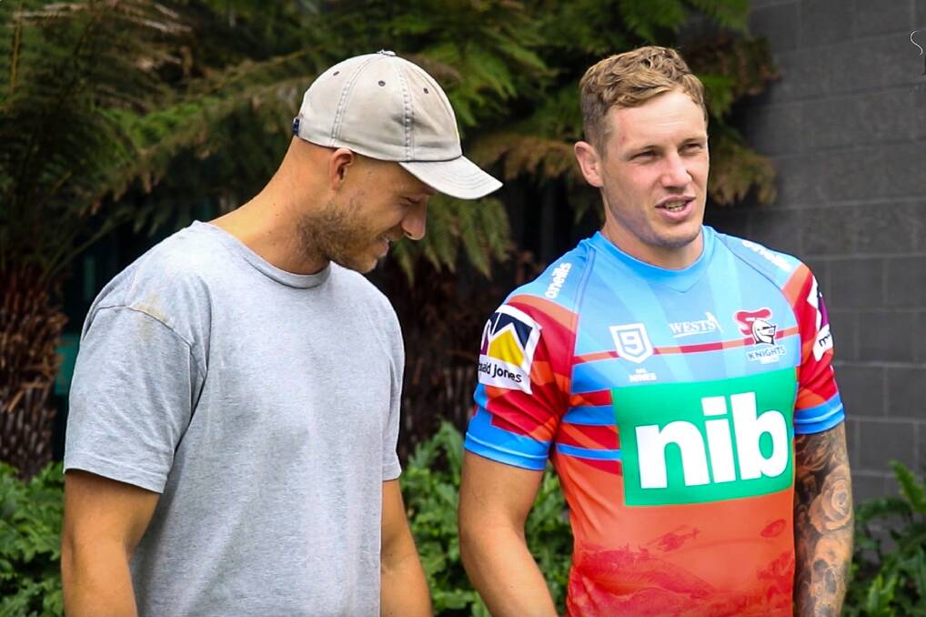 Nice work: Artist Mitch Revs and Nines co-captain Kurt Mann admiring the jersey the Knights will wear in the NRL Nines. Picture: Knights Media.