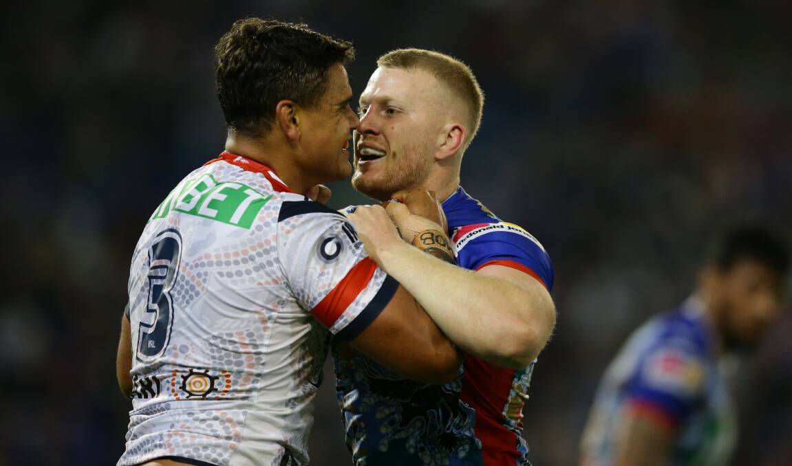 Latrell Mitchell gets up close and personal with Mitch Barnett.