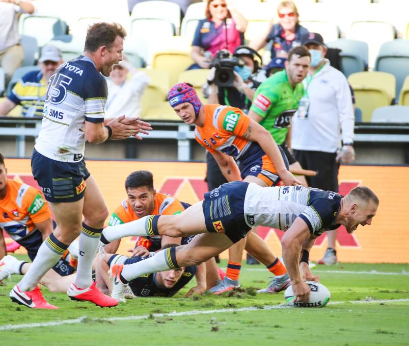 Coen Hess scores a try for the Cowboys.