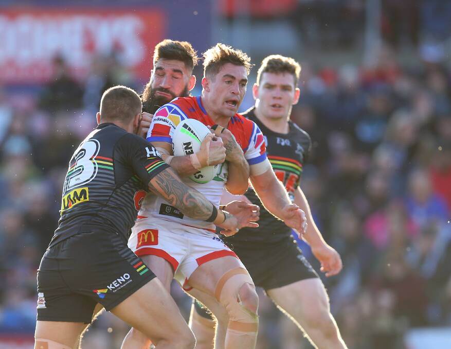 Knights hooker Connor Watson is collared by the Panthers.