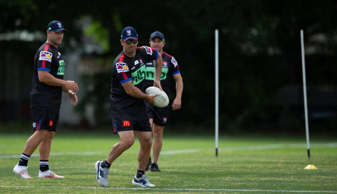 Brains trust: Immortal Andrew Johns at Knights training with assistant coaches Blake Green and Willie Peters watching. Picture: Marina Neil.