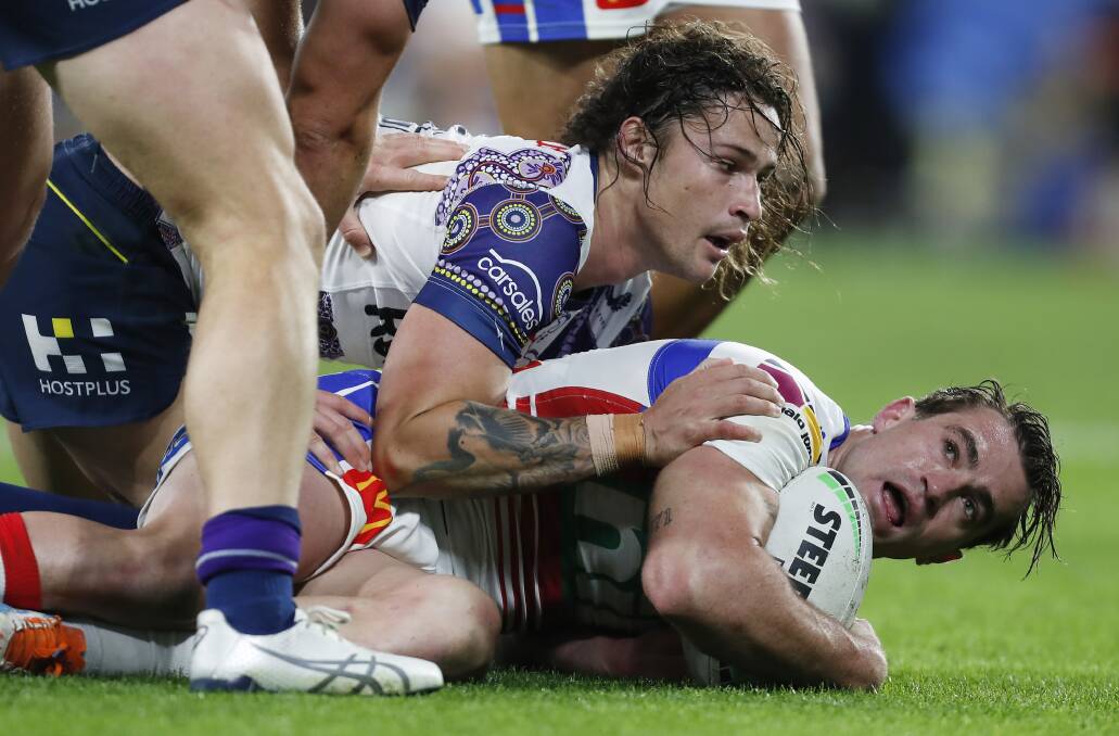 Connor Watson is tackled by Nicho Hynes.
