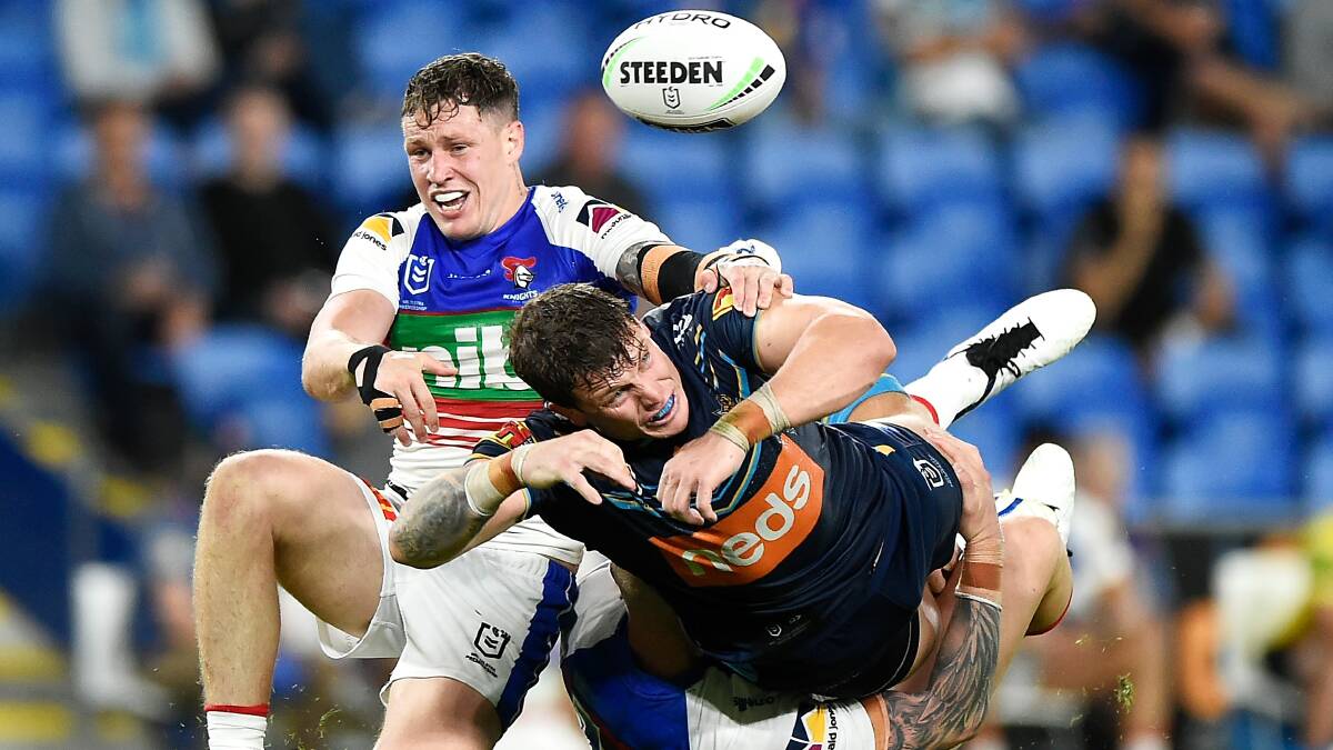  Titans prop Jarrod Wallace comes up with an error in a Kurt Mann tackle.