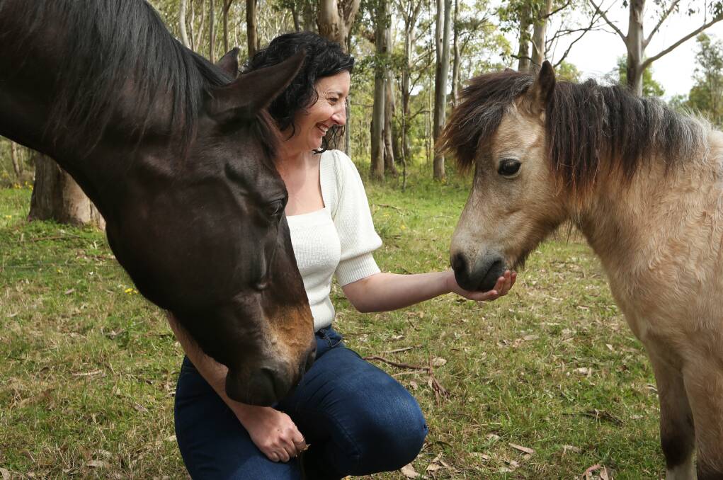 Businesswoman and mum Naomi Rohr with her horses Rev and Eddie on the family property at Duns Creek. Pictures by Simone De Peak