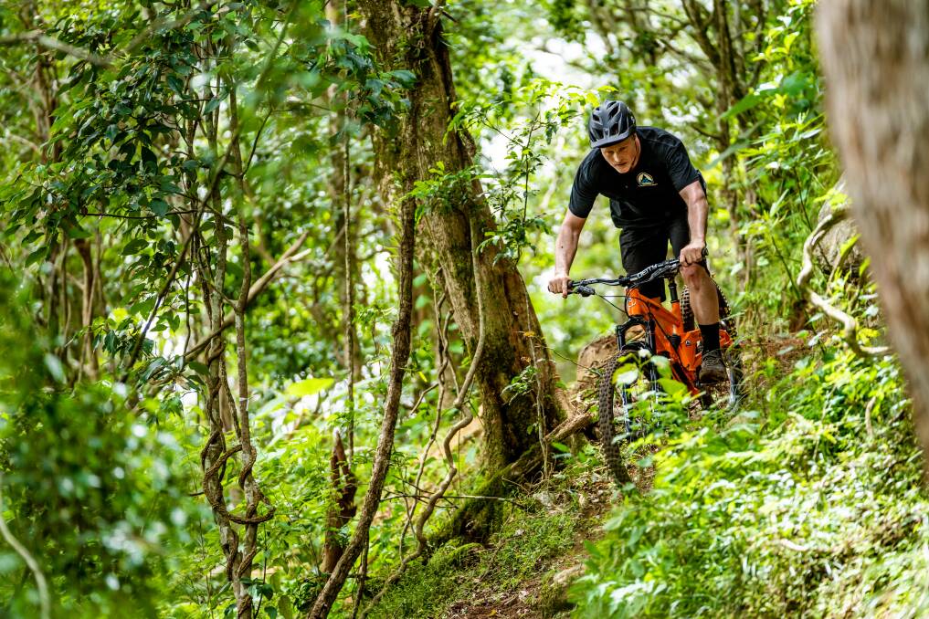 East Coast Mountain Trails owner Mat Rowland takes his bike for a spin on the Barrington Bike Park that he designed and built. Picture supplied 