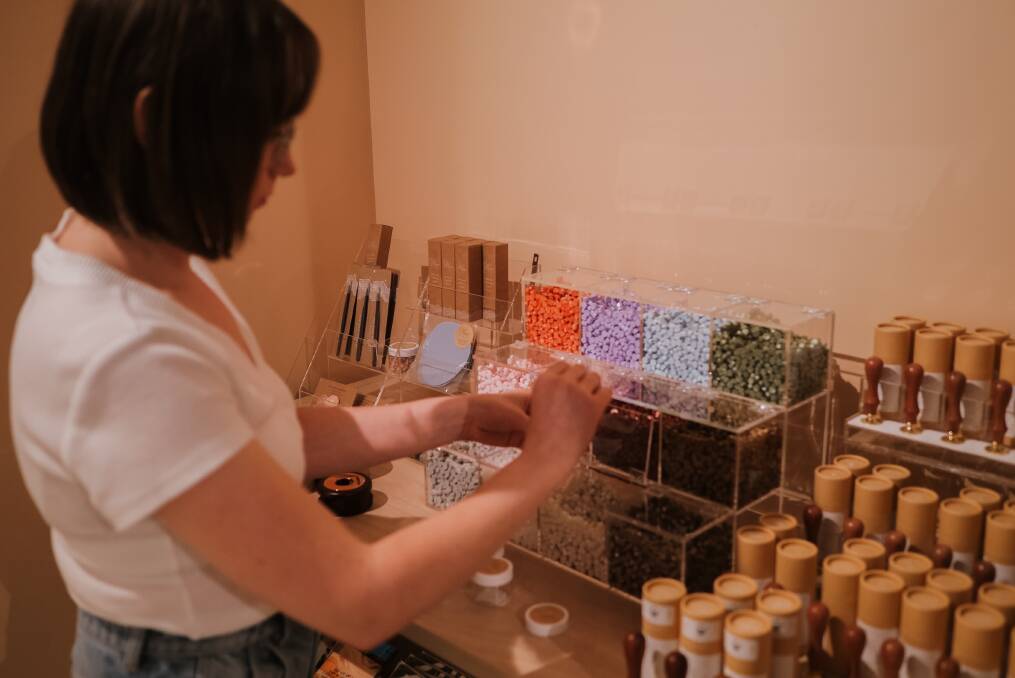 Sign, seal and deliver: Honest Paper co-founder Gabi Graham at the "wax sealing bar" at the store. 