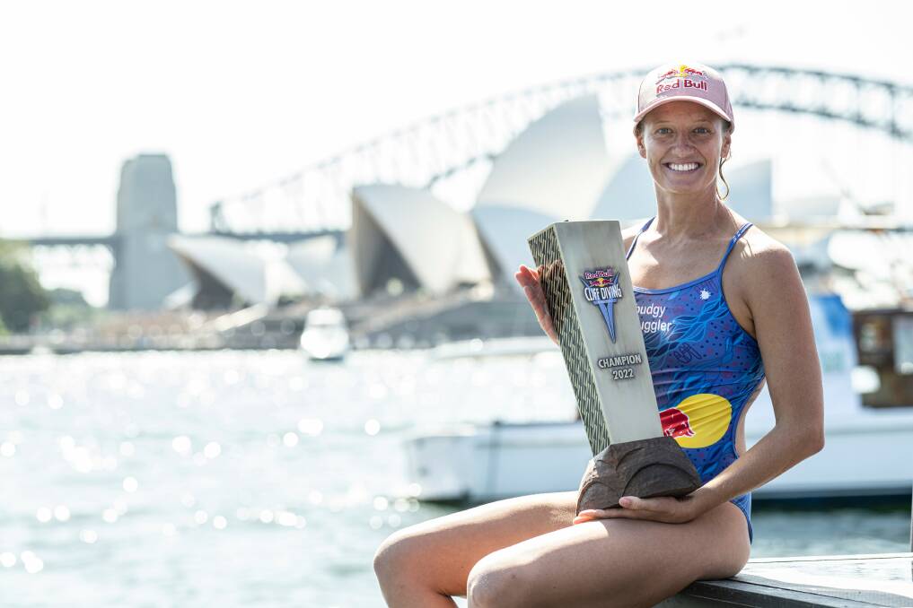 Rhiannan Iffland holds her sixth world champion trophy at the recent Sydney leg of the Red Bull cliff diving series. Picture supplied by Red Bull Content Pool. 