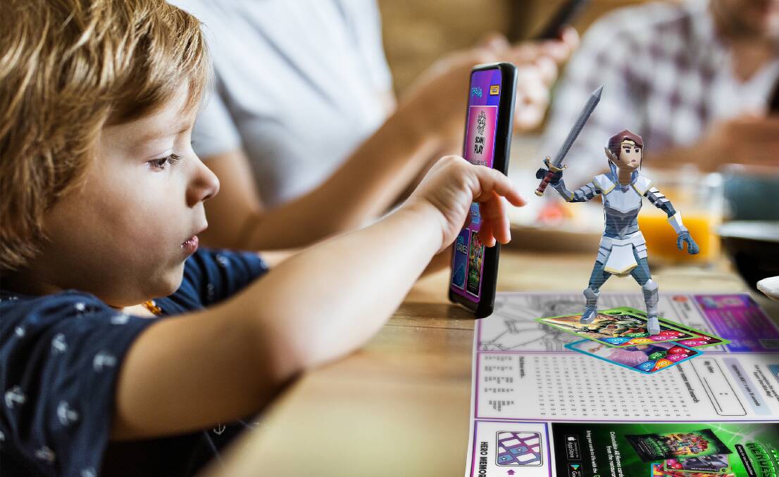 Table talk: A child uses the Grub Lab app to play at the restaurant table. 