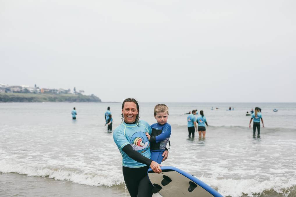 Inclusive: Surfing the Spectrum's Tahlia Anderson with a young charge. 
