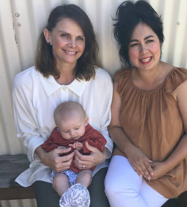 Little gem: "We want to take the brand global but keep production in Australia, that's really important to us," says Mother & Joey co-founder Peta Purcell, left, with baby Vivienne, and business partner Rowena Campbell. Picture: Penelope Green. 