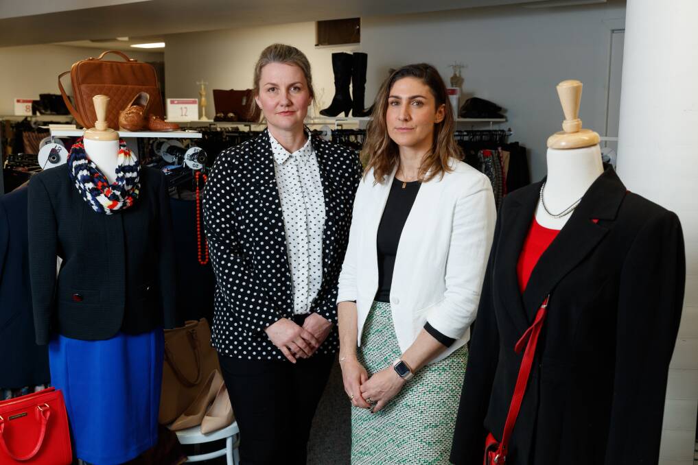 Appeal for funds: Heidi Adnum, left, and Amba Nalbanthof in the Broadmeadow showroom of Dress For Success. Picture: Max Mason-Hubers
