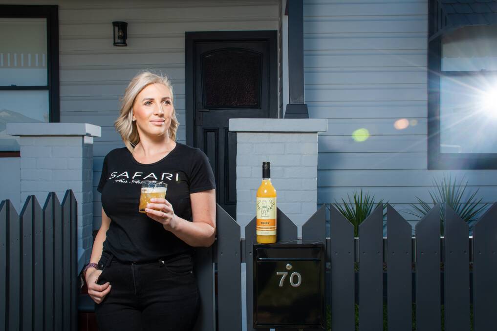 Glass half full: "I did it because I wanted people to be treated. We are in a pandemic," says hair and beauty salon owner Karla Riordan with a home-made cocktail in hand. Picture: Simon McCarthy