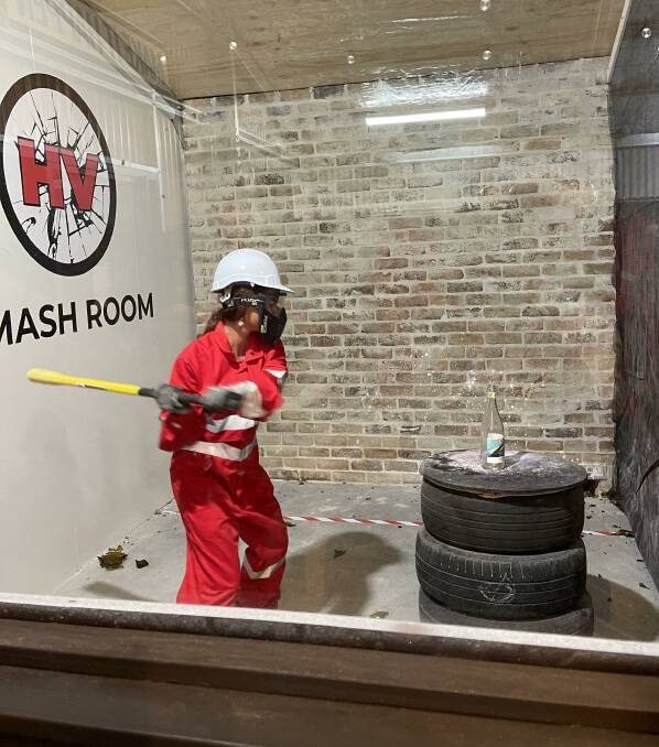 Smashing good time: "It's lots of fun," says The Smash Room's Phillippa Sutton, watching a customer use the facility. 