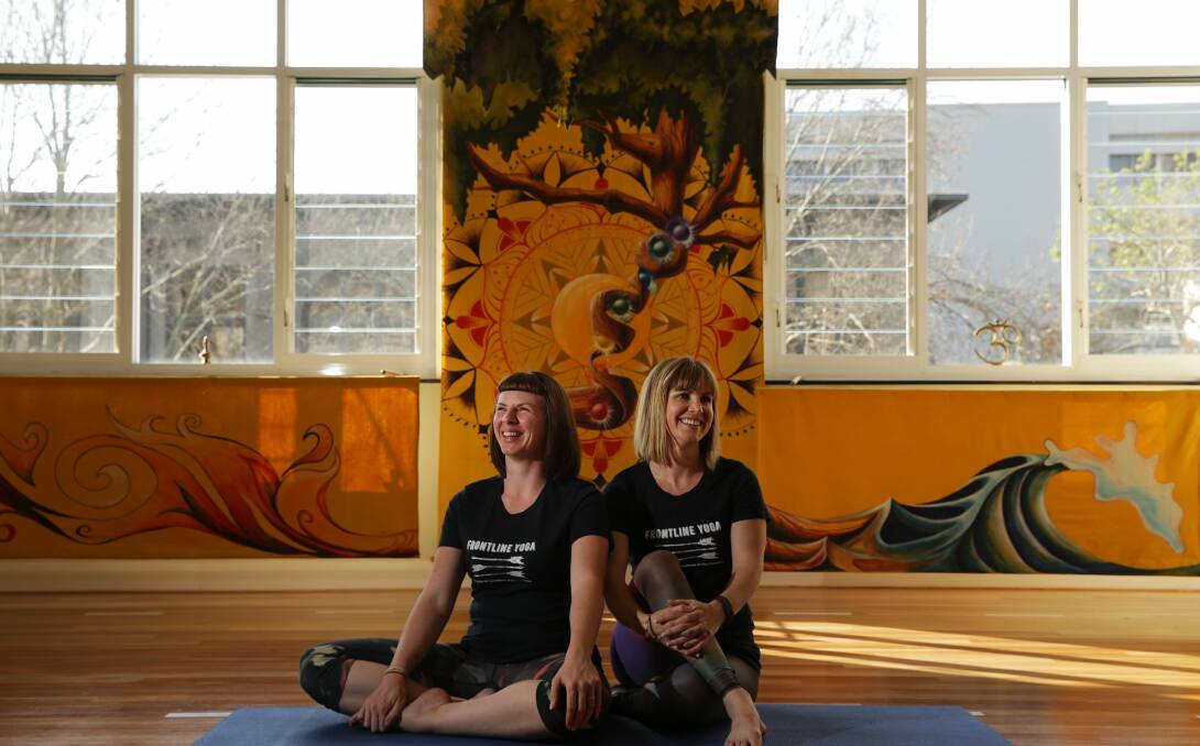 Calming force: Frontline Yoga teachers Kate O'Donoghue and Meg Spry in the latter's Newcastle studio. Picture: Simone de Peak. 