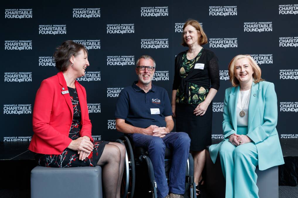 Newcastle Permanent Charitable Foundation chair Jennifer Leslie, far right, with NPCF board director Kate Gray and Spinal Cord Injuries Australia's Rob Wynn and Kitty Bonitz. Picture by Max Mason-Hubers