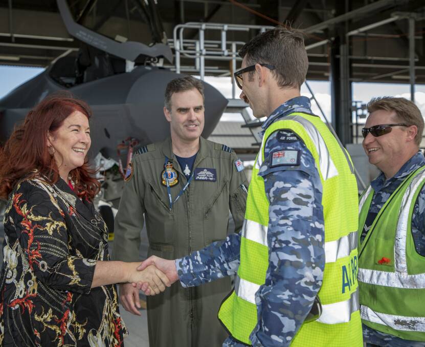 Snap visit: Minister Melissa Price with Wing Commander Darren Clare and technicians at Williamtown. 