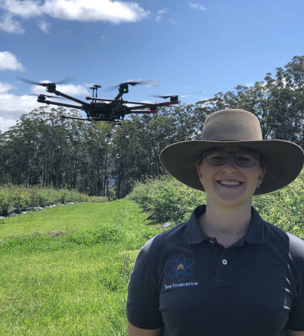 Fields of potential: Kate Lyall with BeeDar technology on a drone. 