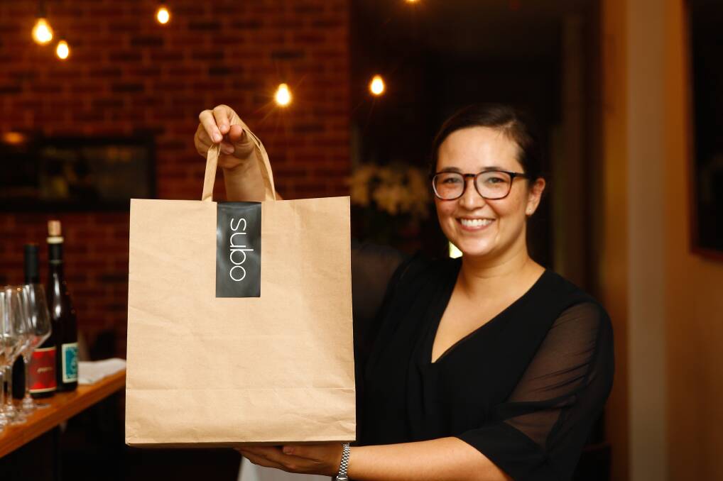 Dishy option: Suzie Vincent with a sample offering of the new take-away menu her chefs will prepare next week. Picture: Jonathan Carroll