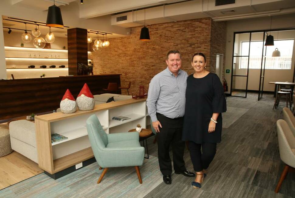 Happier times: Brett and Louise Dann at their then newly opened Hunter Travel Group headquarters in Hunter Street in 2018.