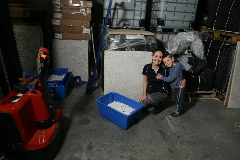 Eco warriors: Resourceful Living co-founder Jess Hodge with son Eric at her Beresfield factory. Picture: Jonathan Carroll