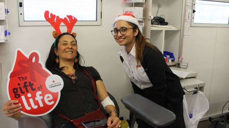 GIFT OF LIFE: A donor and Lifeblood employee at a donor lifeblood unit. Picture: Supplied