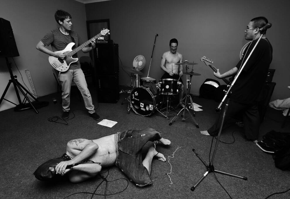 YOUNG PUNKS: Obat Batuk thrashing it out during rehearsal. Picture: Shane Quill