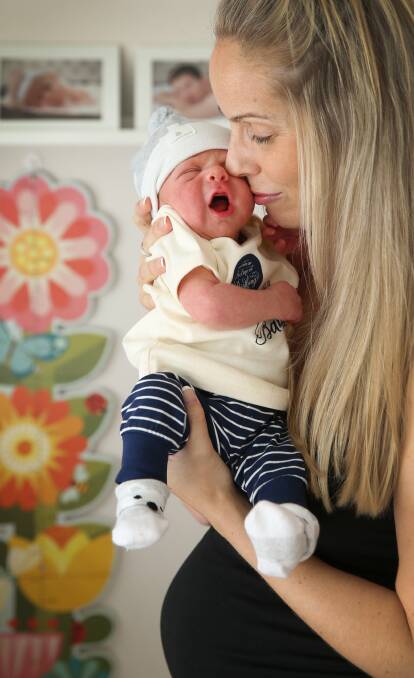 HOME DELIVERED: Vanessa Teunissen with five-day-old Finley who was born at home in Eleebana. Picture: Marina Neil